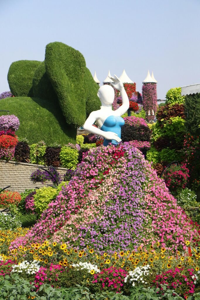 A stunning floral exhibit featuring colorful flowers and topiary in Dubai Miracle Garden.